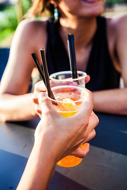 fresh drink to enjoy a summer happy hour. detail close up of the plastic glass.